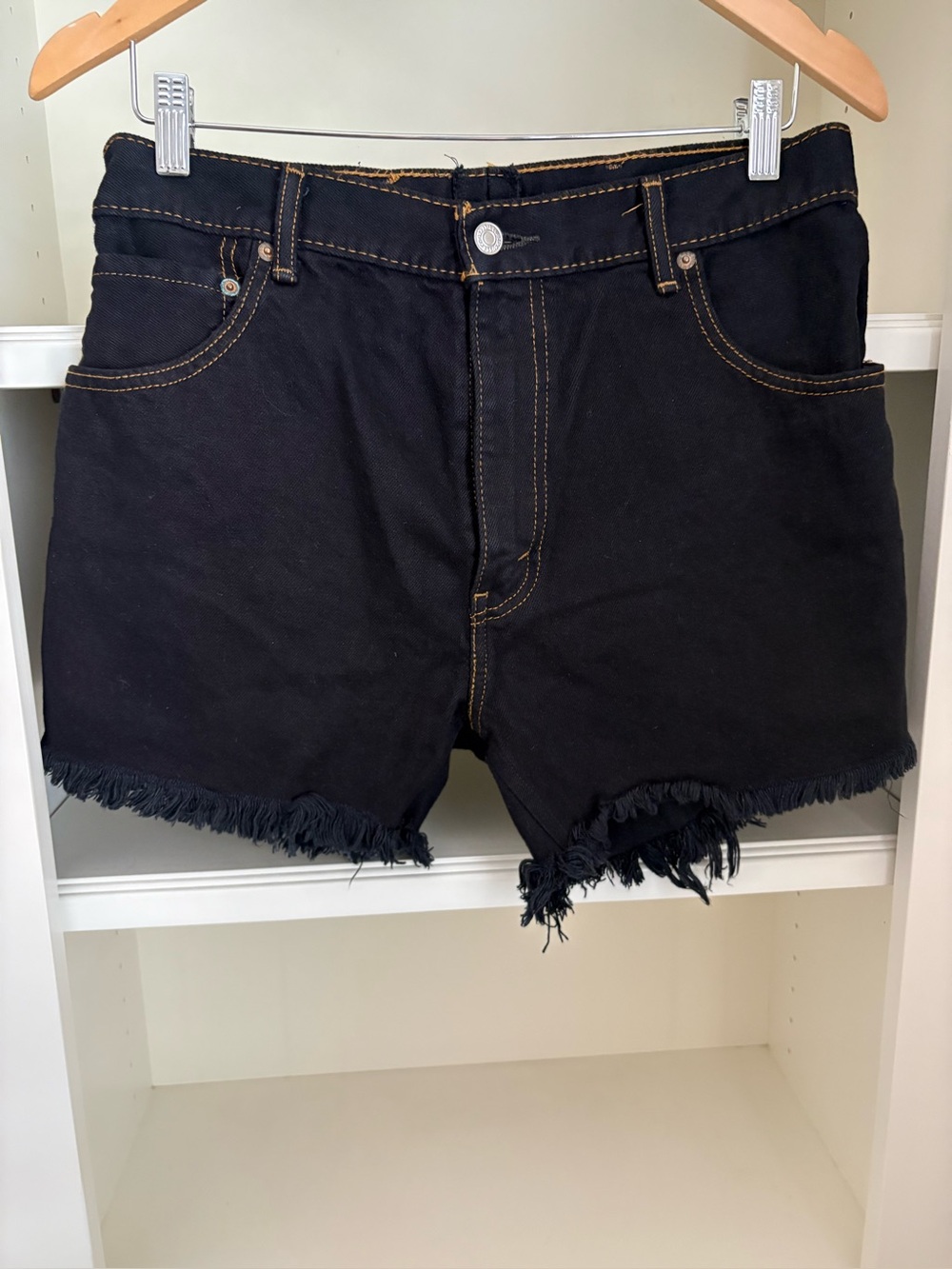 Urban Renewal recycled Levi's denim shorts with a raw, frayed hem black 517